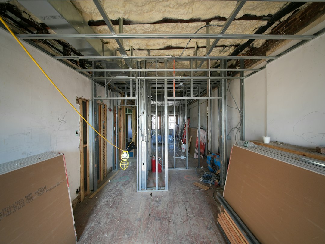About A three-story brownstone stands in mid-transformation, captured at the raw and honest “before” stage of a full interior renovation. These images document a moment that usually disappears once the walls are closed and the finishes are installed — exposed framing, stripped ceilings, rough staircases, and open corridors that reveal the building’s original structure and hidden history. Light spills in through skylights and tall windows, cutting through layers of dust and unfinished surfaces, creating a quiet contrast between decay and renewal. The space feels both industrial and intimate: narrow